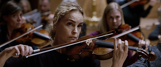 Nina Hoss (Mitte) in "Tár" (2022) Nina Hoss (Mitte) in "Tár" (2022)