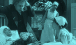 Screenshot mit Conrad Veidt (liegend), Eduard von Winterstein (2.v.l.), Sybil Morel (vorne rechts) aus "Opium" (1919); Quelle: Filmmuseum München