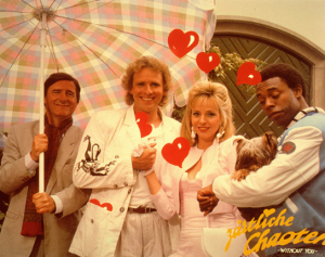 Helmut Fischer, Thomas Gottschalk, Dey Young, Michael Winslow (v.l.n.r.) in "Zärtliche Chaoten" (1987); Quelle: DFF